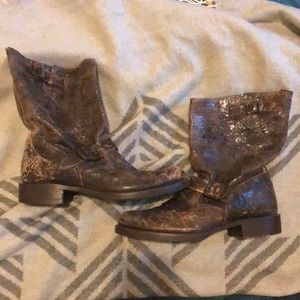 Brown distressed Frye boots.